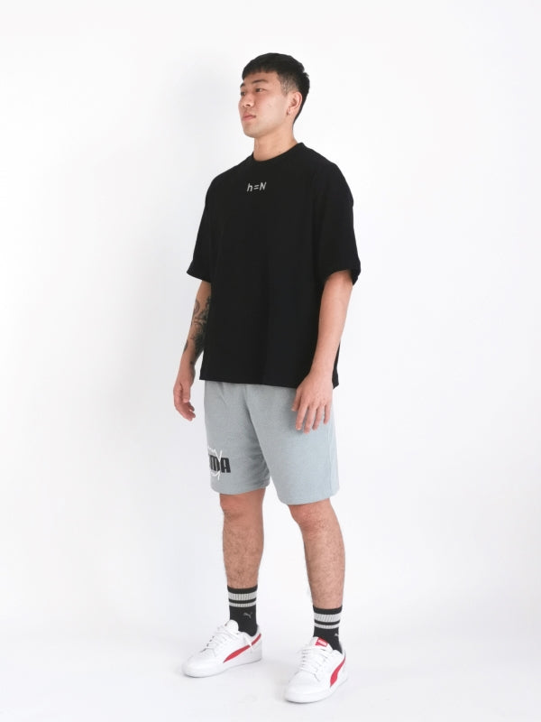 initial hypothesis essential oversized tee design on male model to display right diagonal side view