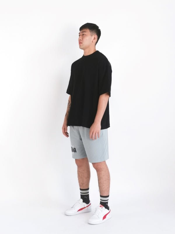 alternative hypothesis essential oversized tee design on male model to display right diagonal side view