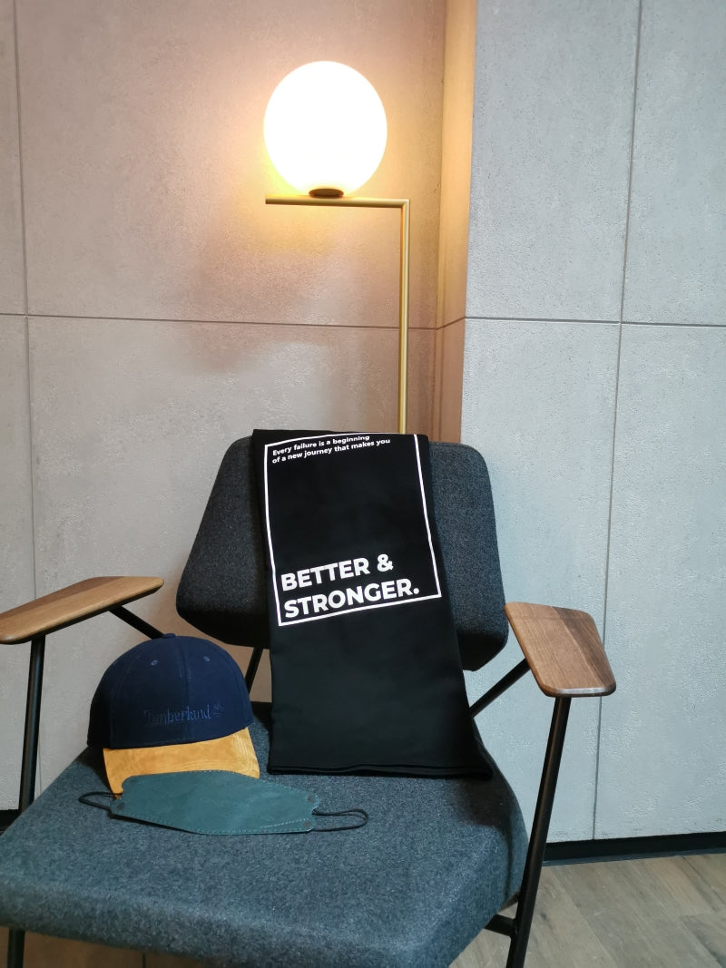 better and stronger design tshirt placing on the chair with a cap and a facemask