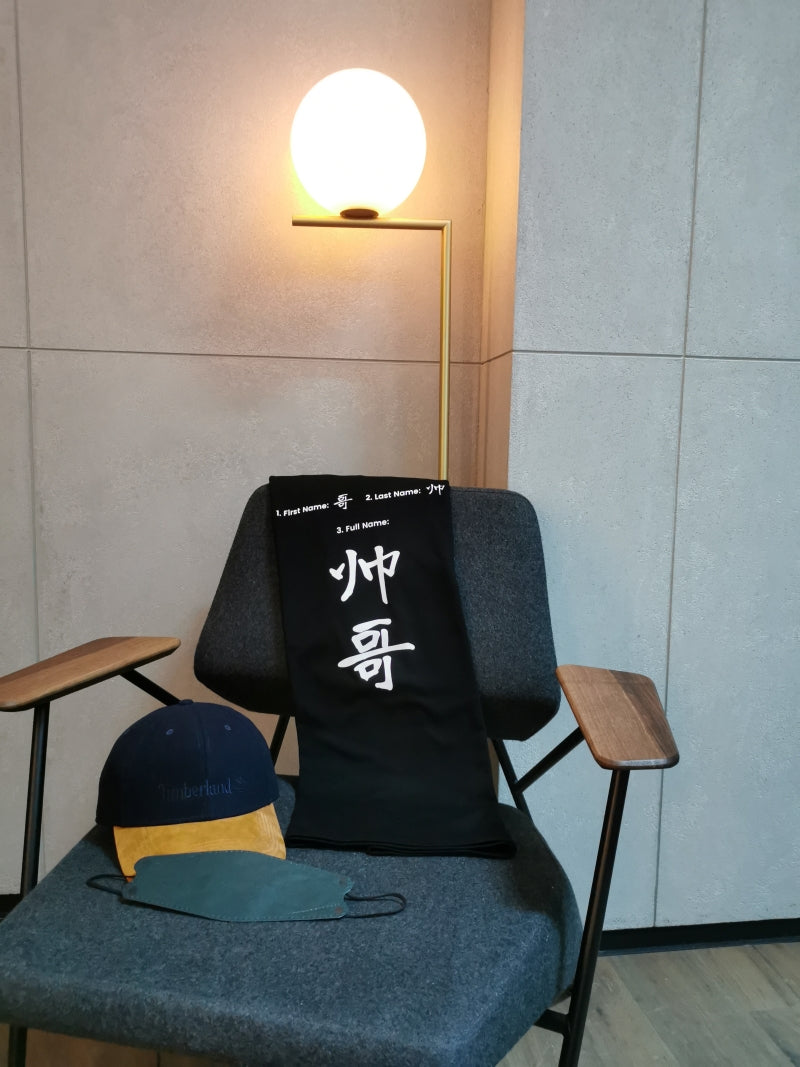 handsome design tshirt placing on the chair with a cap and a facemask