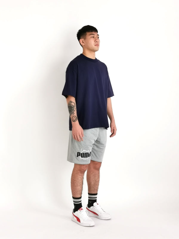 simple hypothesis essential oversized tee design on male model to display left diagonal side view